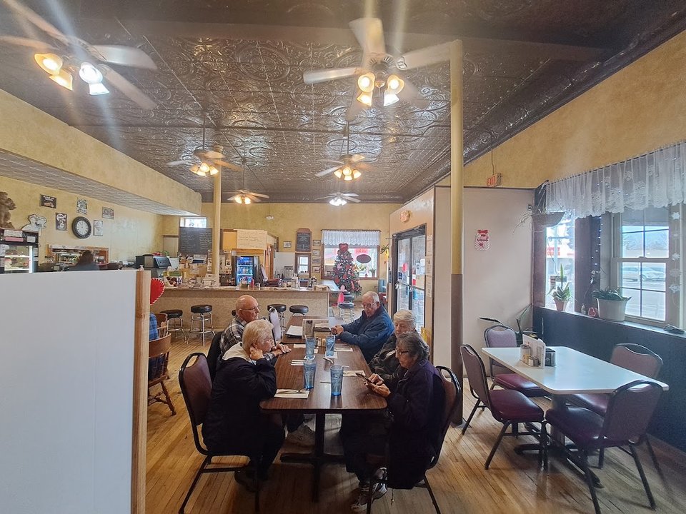 Warm dining room with booths and table service.
